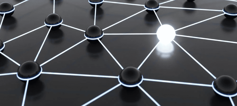 Abstrakte Darstellung eines Netzwerks mit schwarzen Knotenpunkten, die durch leuchtende Linien verbunden sind – ein zentraler, heller Knoten leuchtet herausragend.